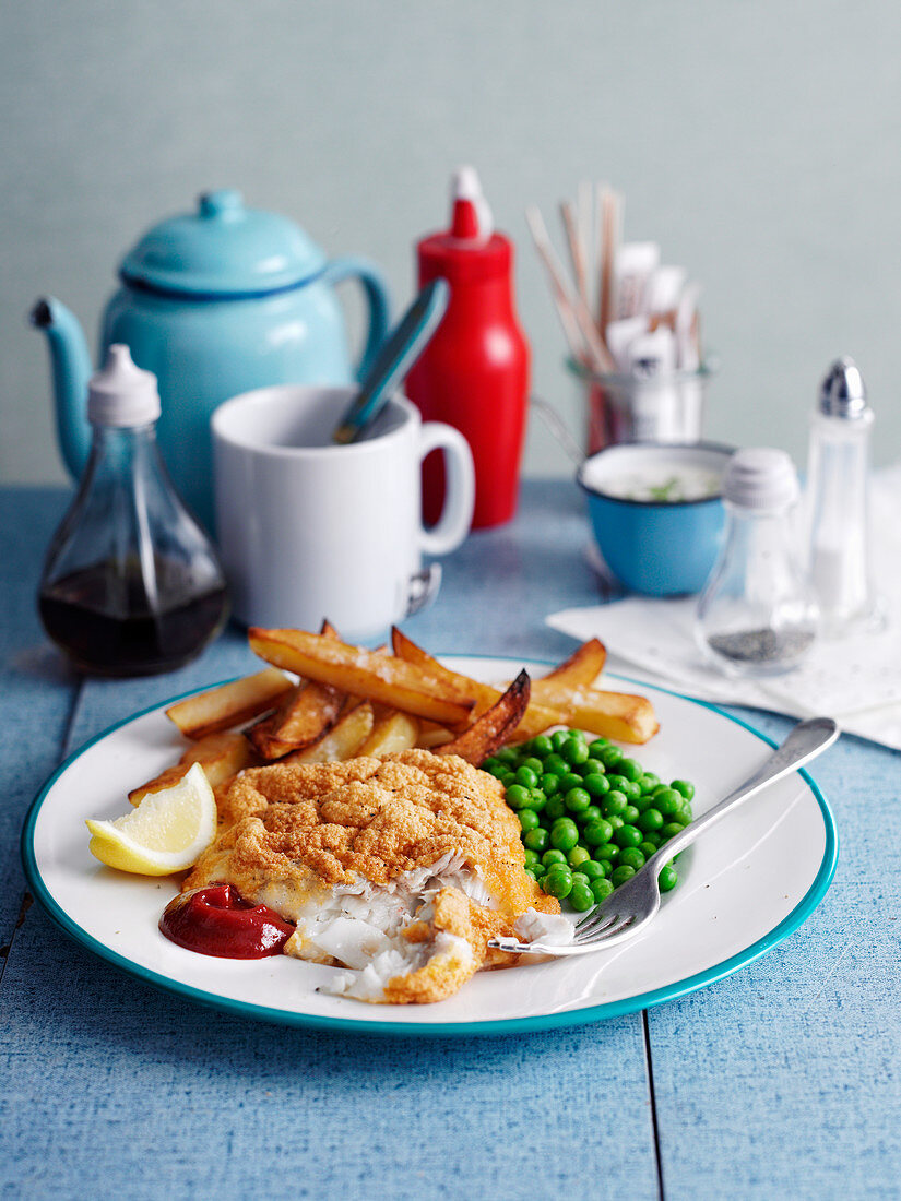 Breaded fish with peas and chips