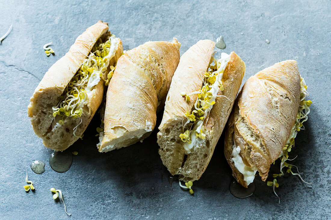 Goat's cheese and honey baguette with radish sprouts