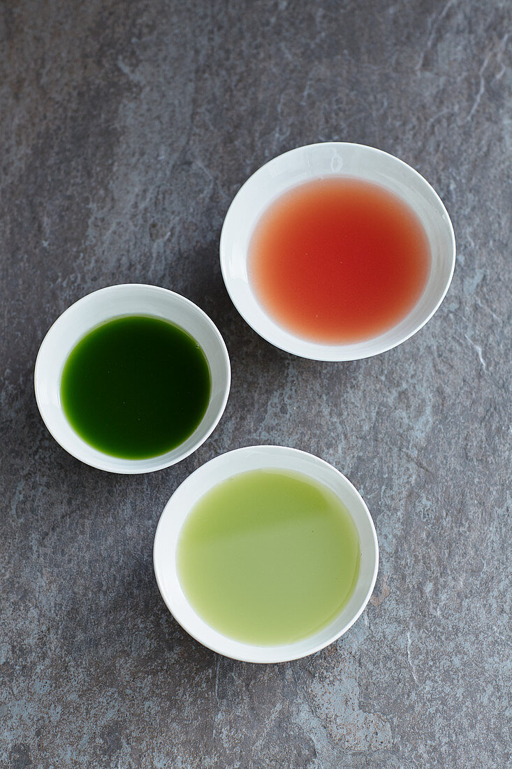 Tomato, cucumber, and apple and celery juice in bowls