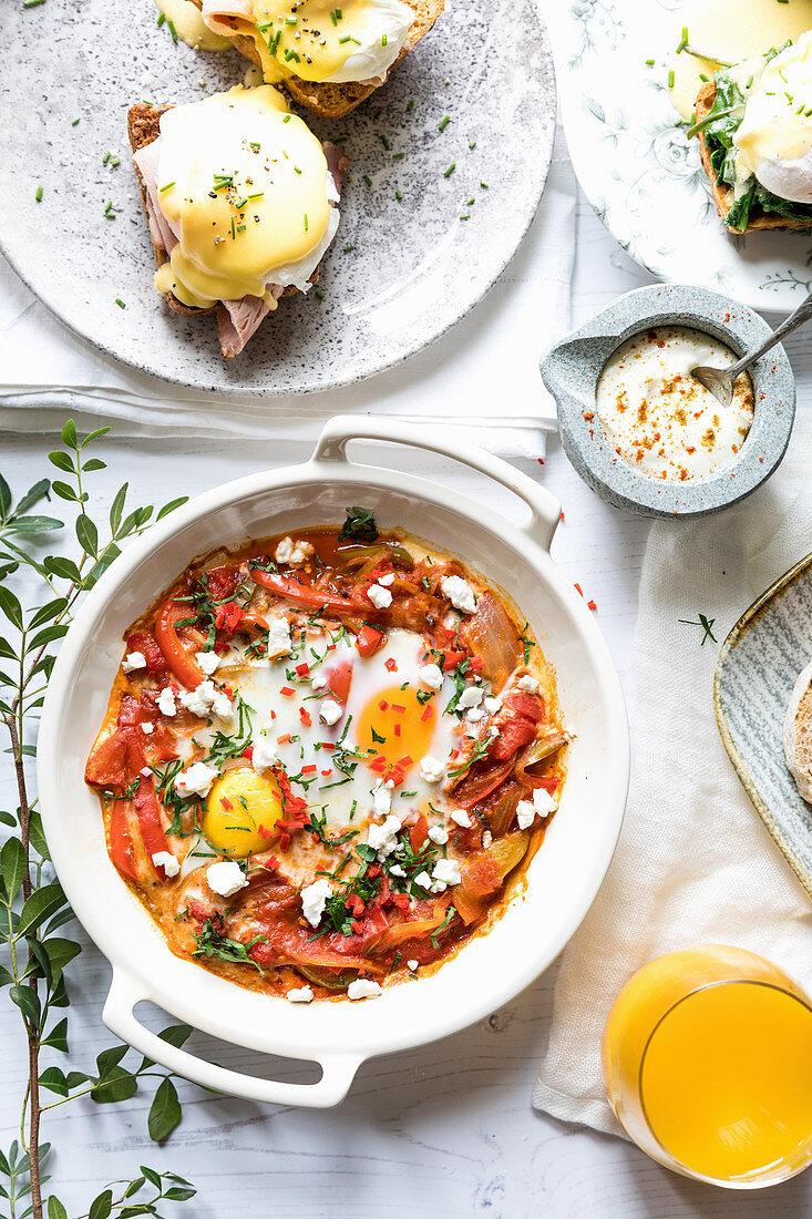 Shatshuska with poached eggs in the background