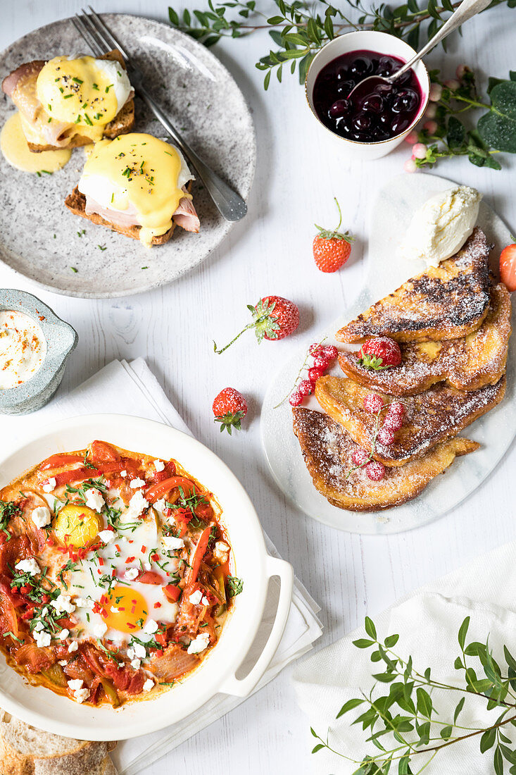 French toast with jam, shatshuska and poached eggs on toast