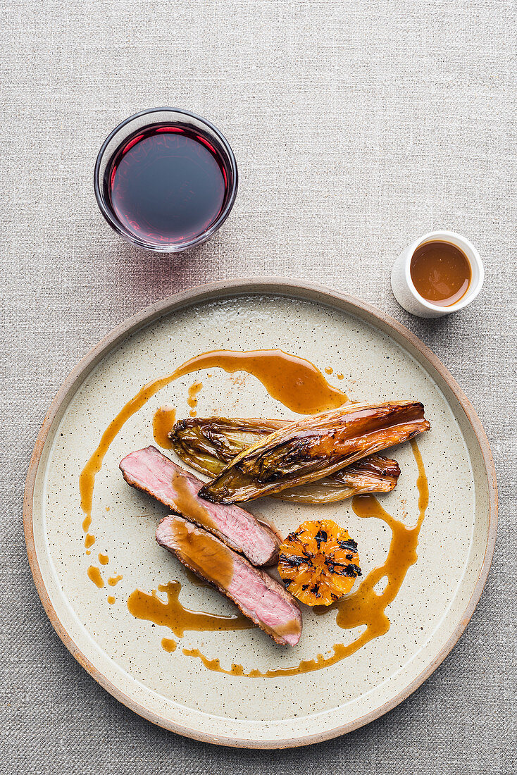 Beef fillet with grilled mandarins and chicory