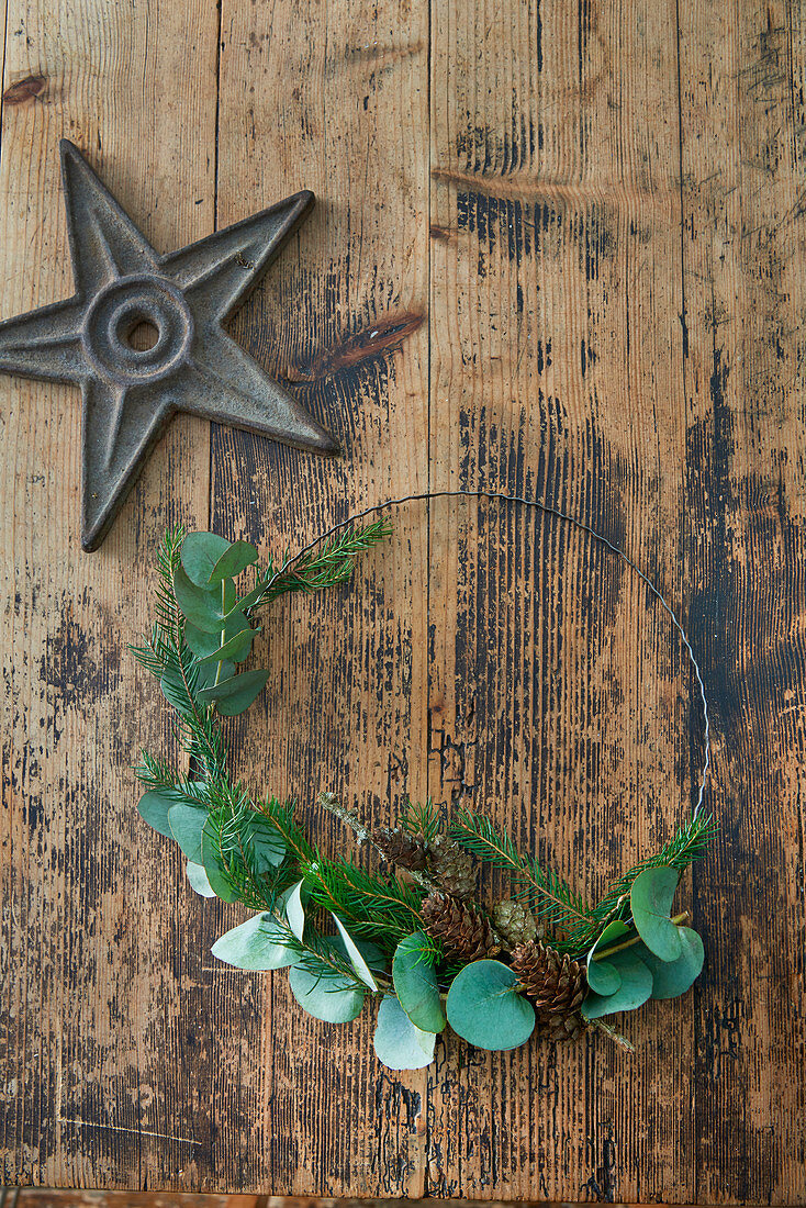 Minimalist wreath of fir sprigs and eucalyptus