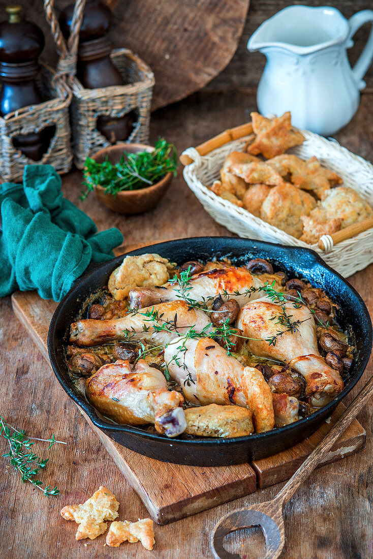 Chicken legs with mushrooms and thyme in creamy sauce