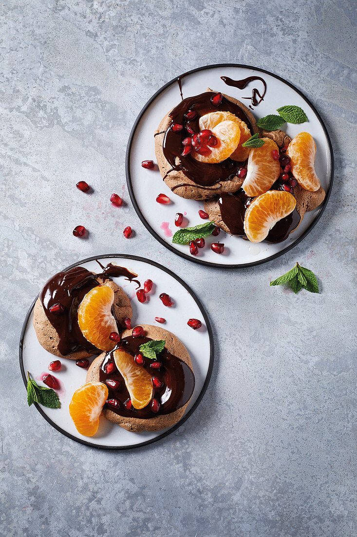 Mandarin-topped chocolate meringue nests