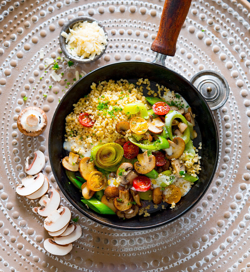 Fried vegetables with bulgur and mushrooms