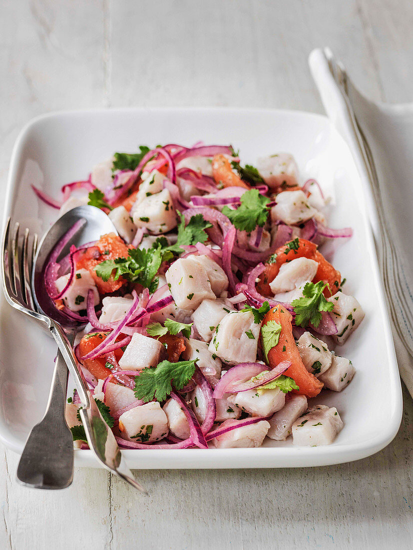 Swordfish ceviche with red onion tomato and coriander marinated in lime juice and garlic