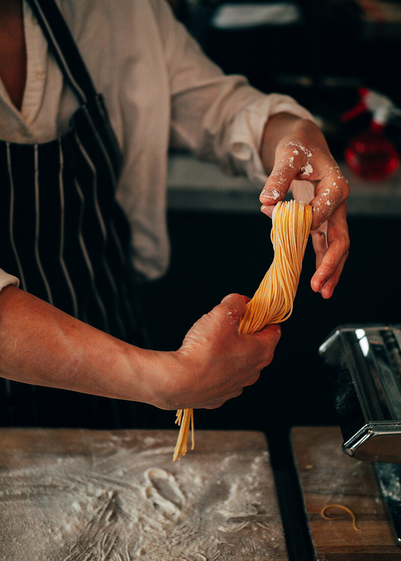 Crop cook making spaghetti