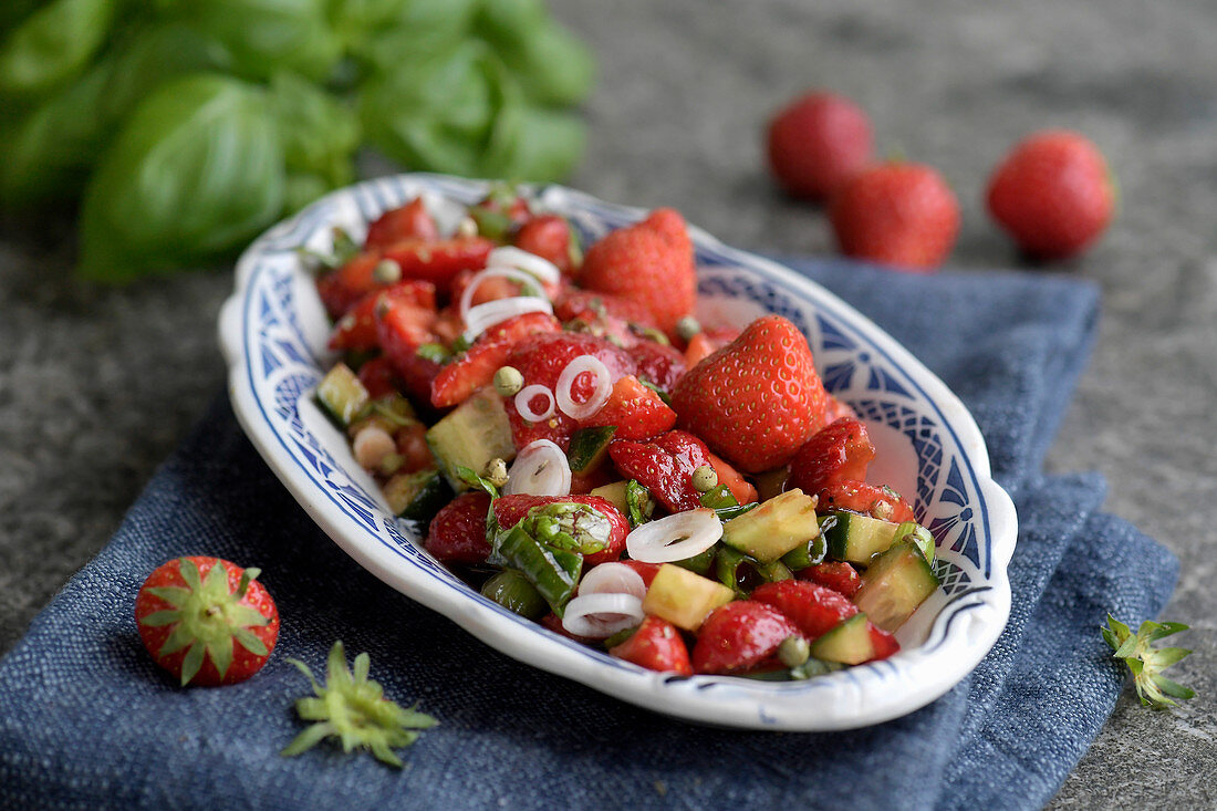 Strawberry salsa with cucumber, peppers and basil