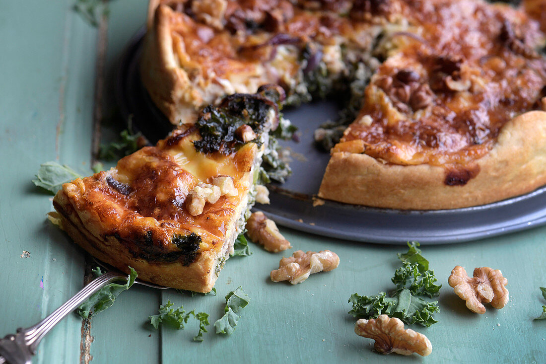 Winter kale quiche with walnuts, sliced