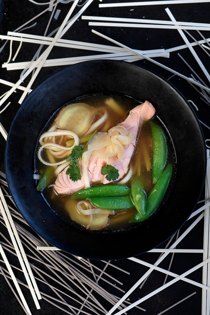 Noodle soup with salmon, mange tout and ginger