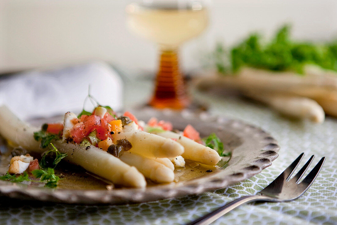 White asparagus with tomatoes and brown lemon butter