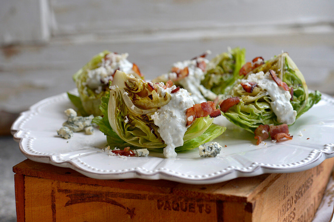 Grilled iceberg lettuce salad with bacon, blue cheese and horseradish