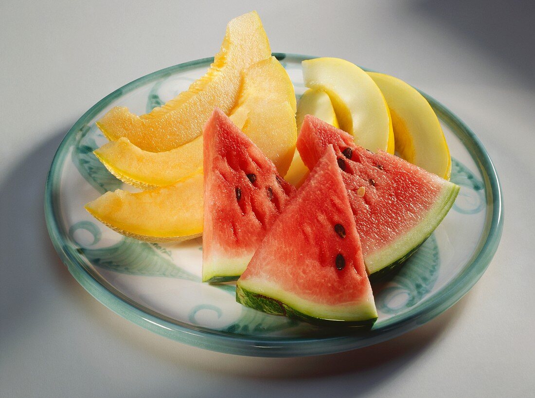 Slices of Watermelon and Crenshaw Melon on a Plate