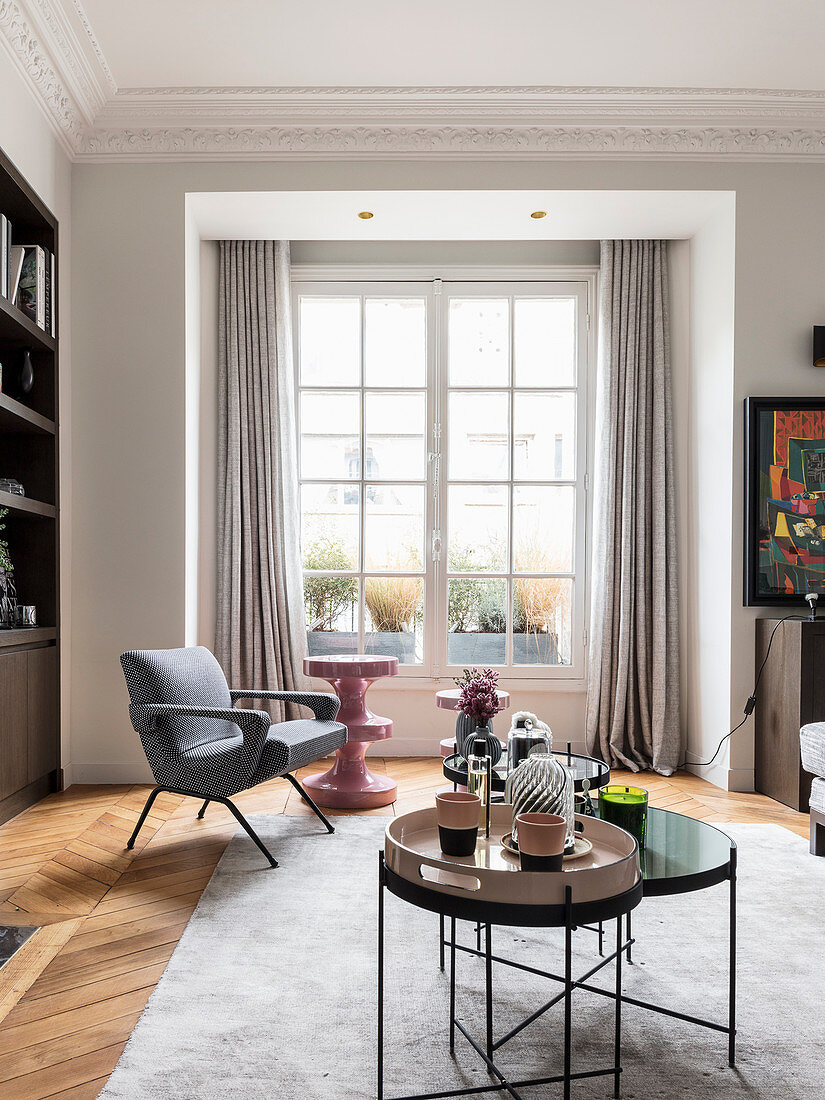 Modern furniture in living room with lattice window and stucco ceiling