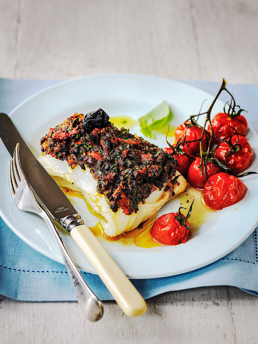 Roast Cod topped with olive and sun dried tomato tapenade and roast tomatos