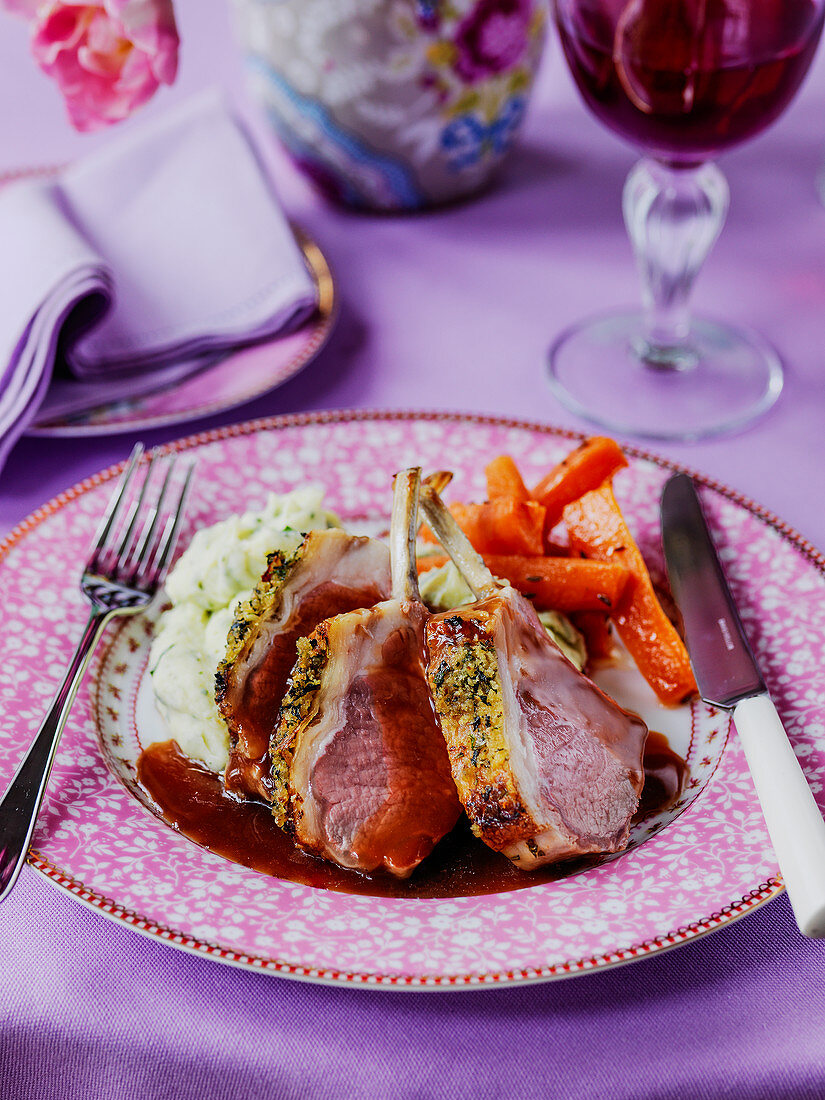 Easter rack of lamb with pistachio herb crust glazed carrots and mashed potato with red wine gravy