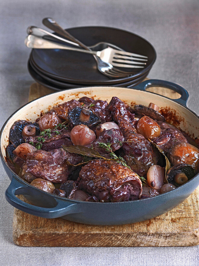 Coq au vin made with chicken, mushrooms, shallots, herbs and red wine