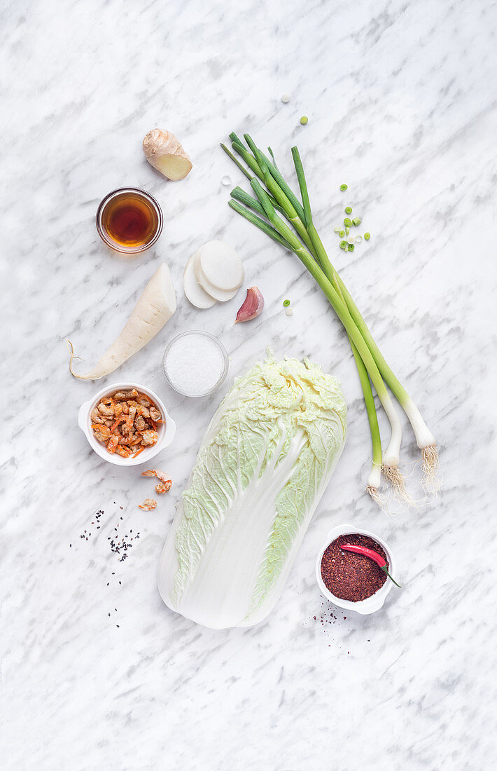 Different fresh vegetables on marble plate