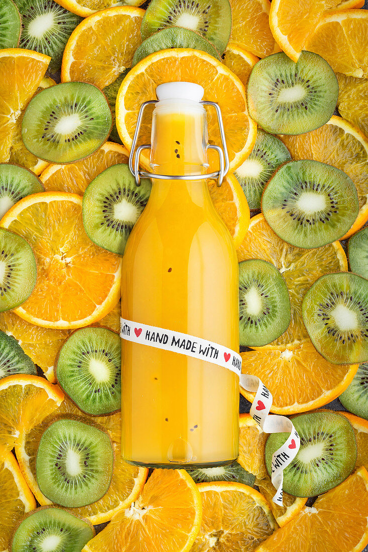 Handmade juice of kiwifruit and orange pieces
