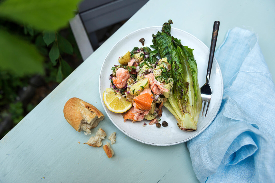 Grilled crispy lettuce with herb potatoes and salmon