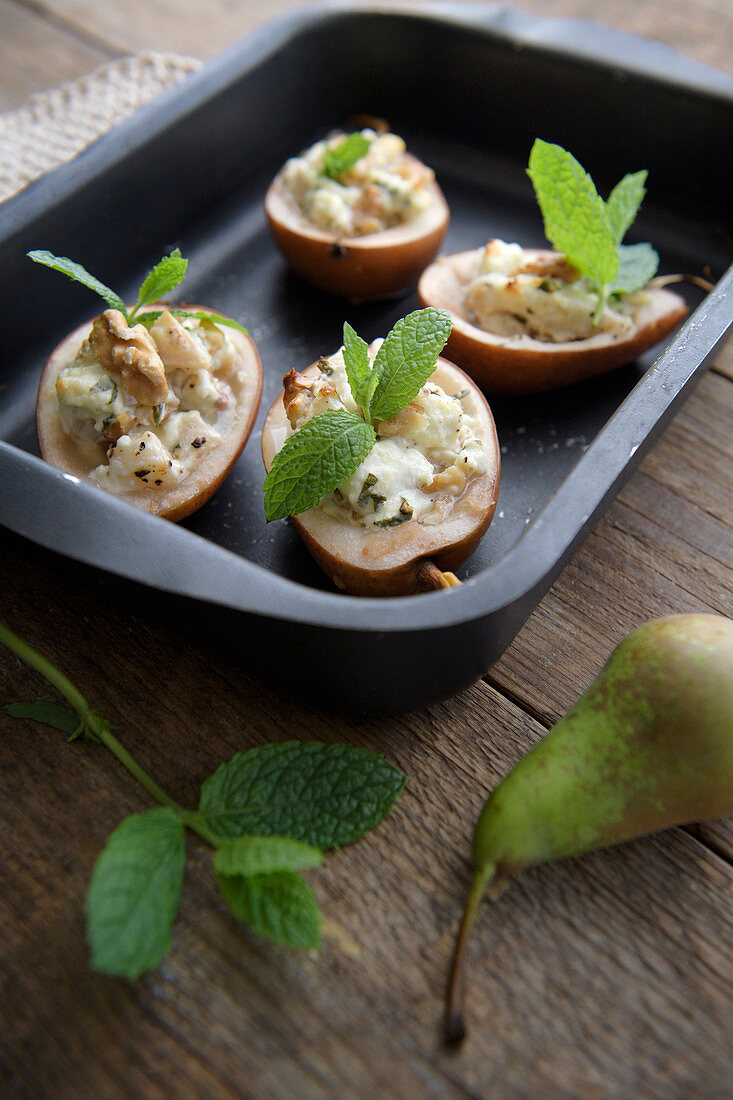 Stuffed roasted pears with feta cheese, walnuts and mint