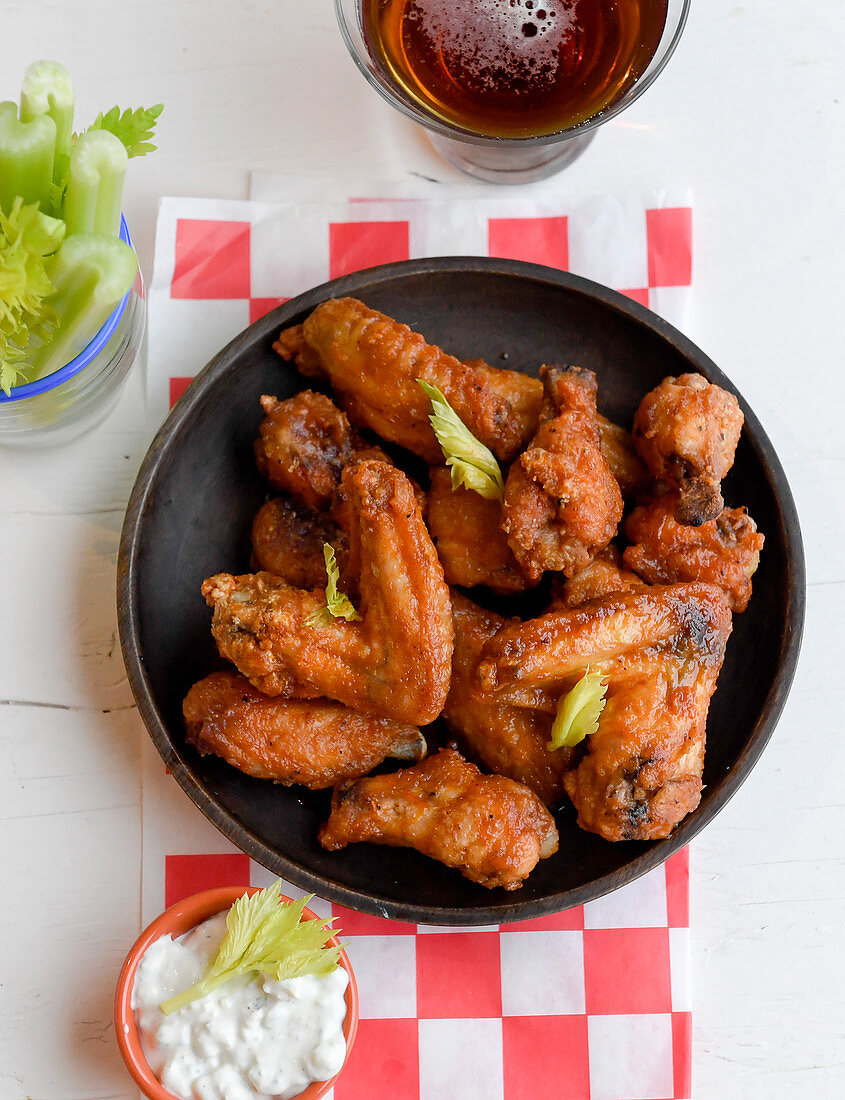 Spicy buffalo chicken wings with beer