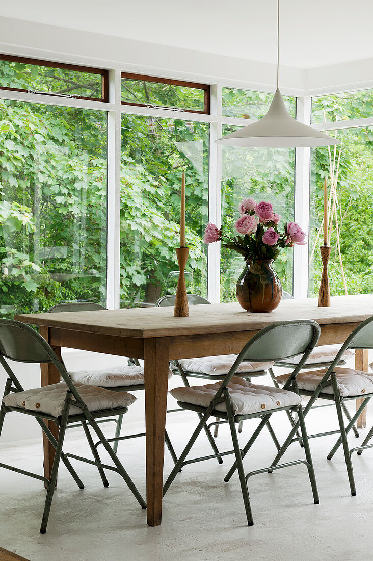 Vintage metal chairs around farmhouse table