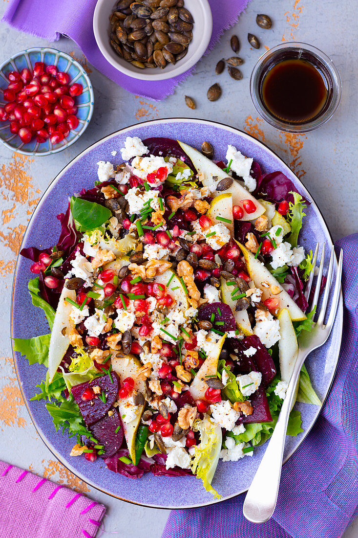 Salad with beetroot, pear, pomegranate and feta