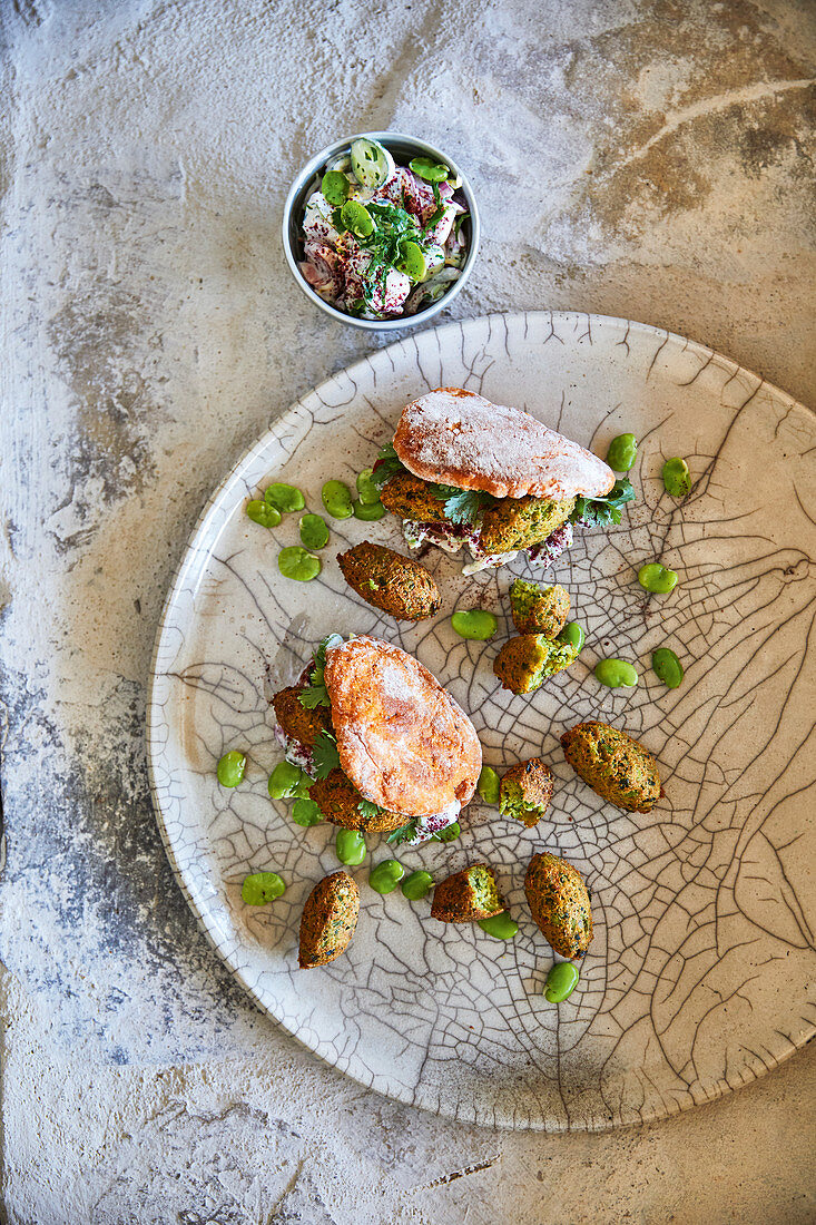 Broad bean balls with naan bread and sumac salad