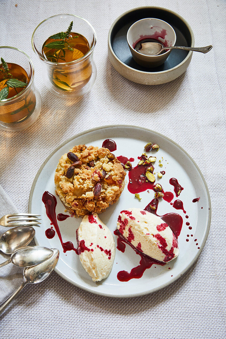 Pear crumble with mascarpone cream and red wine syrup