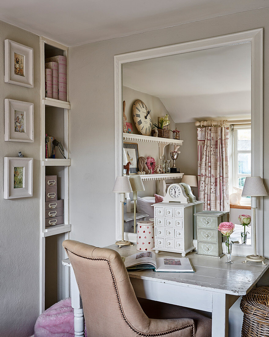 Leather chair at wooden desk with large mirror in girl's room