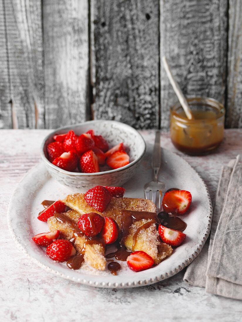 French toast with strawberries and caramel sauce