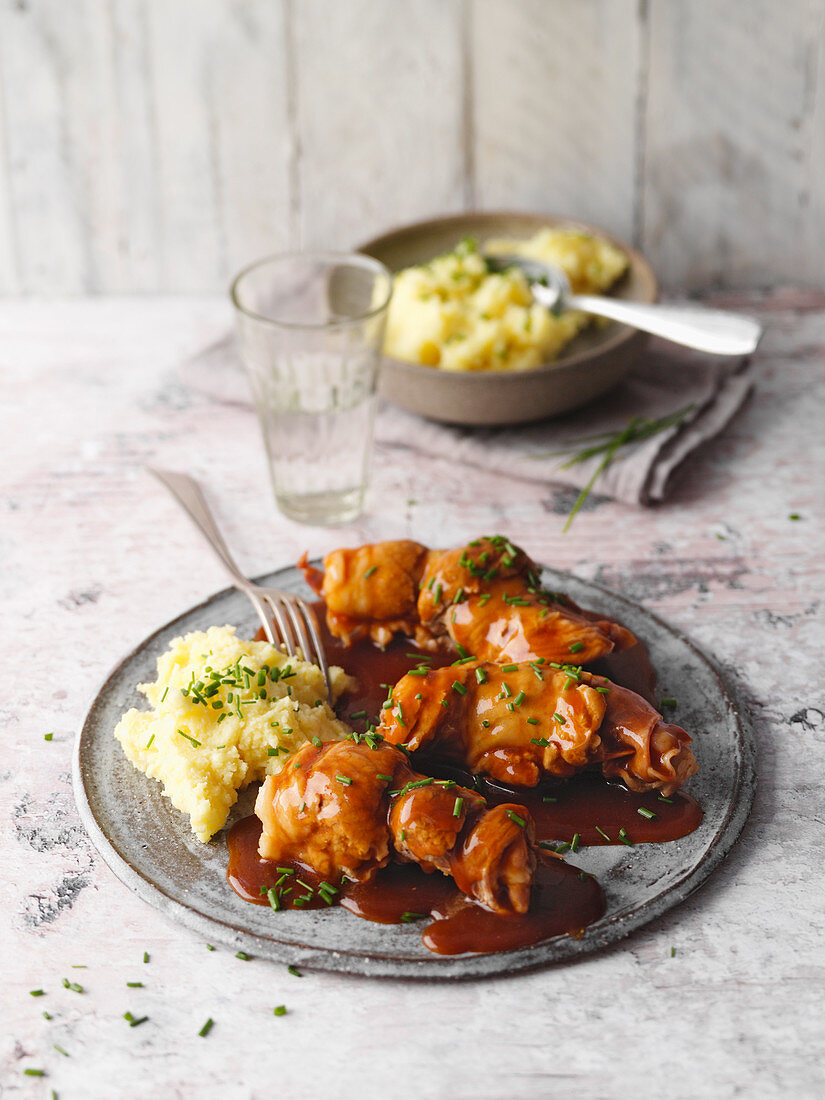 Pork belly roulade from the Eifel region, Germany with beer sauce and mashed potatoes