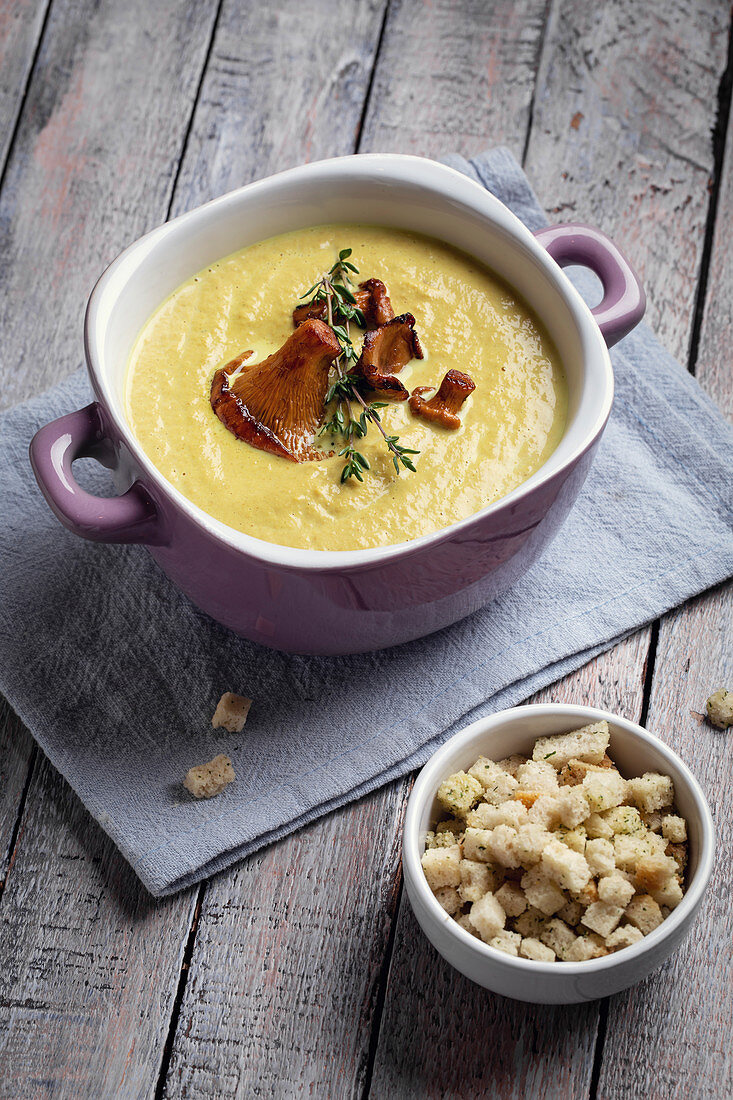 Chanterelle mushroom cream soup with thyme and croutons