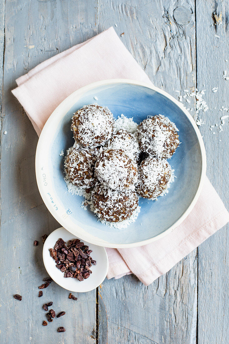 Vegan flaxseed energy balls with hemp and grated coconut