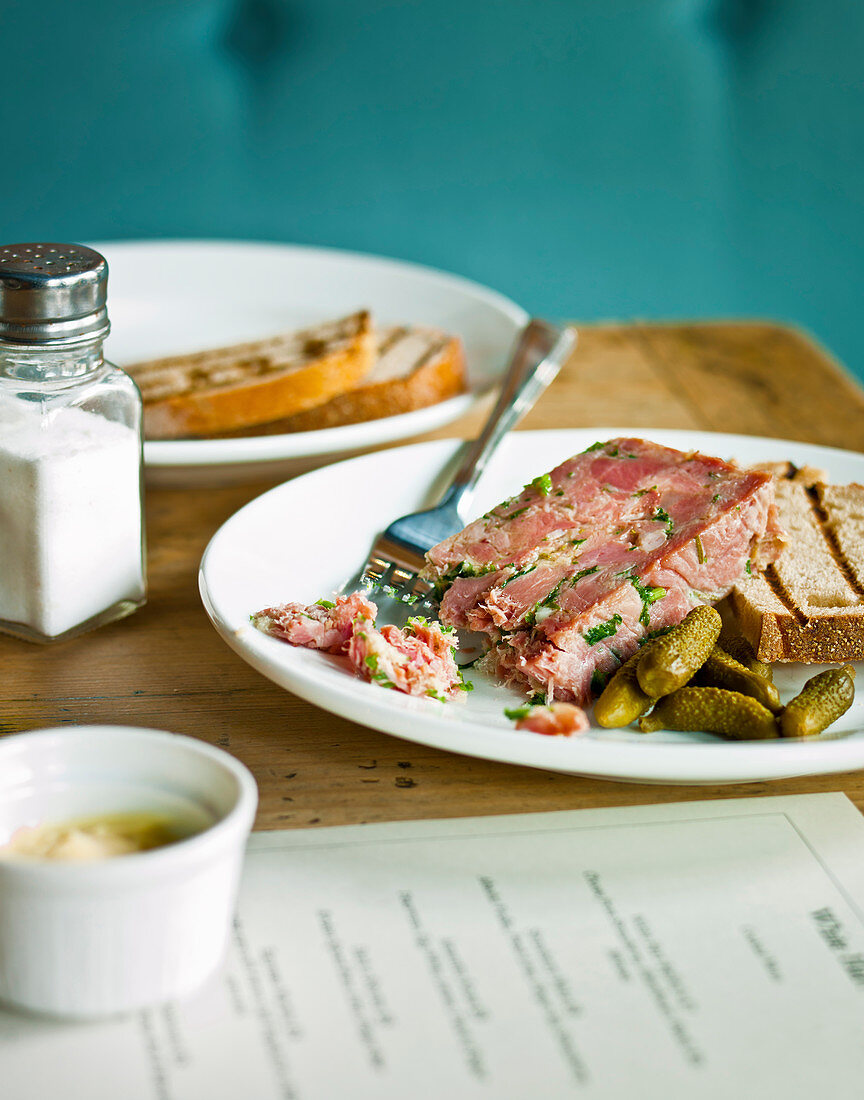 Ham hock terrine with parsley, guerkins and white toasted bread