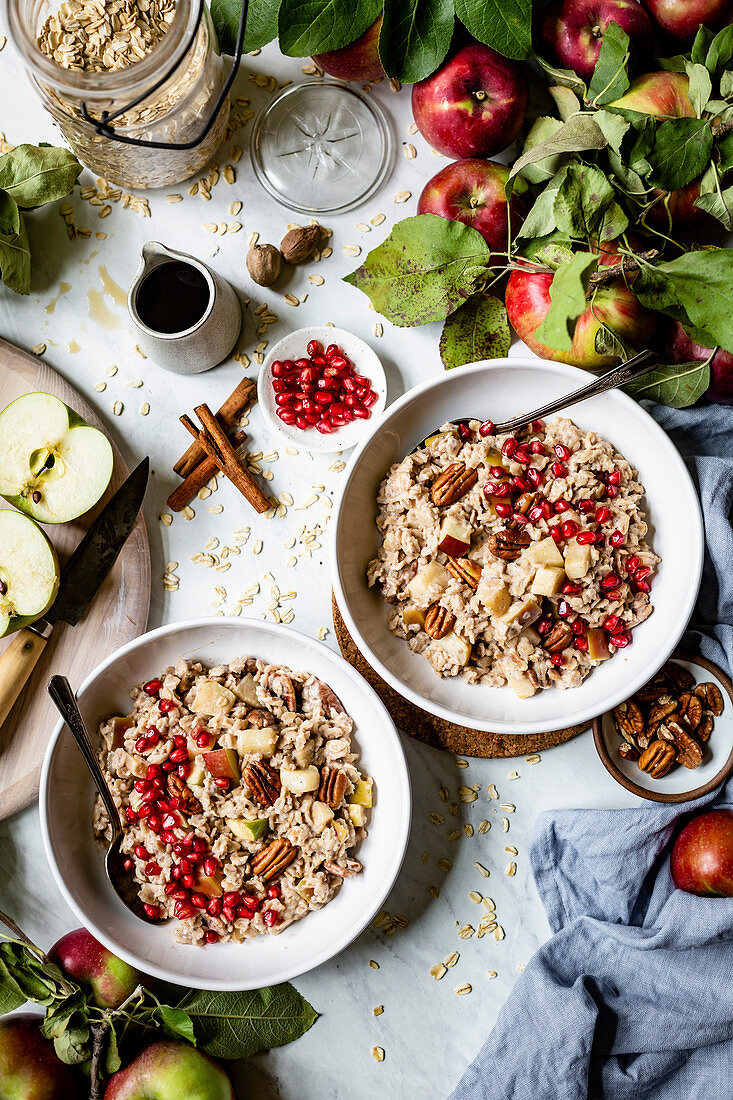 Oatmeal with apple, cinnamon, pecans, and pomegranate for breakfast