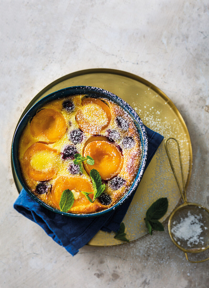 Peach clafoutis with black cherries