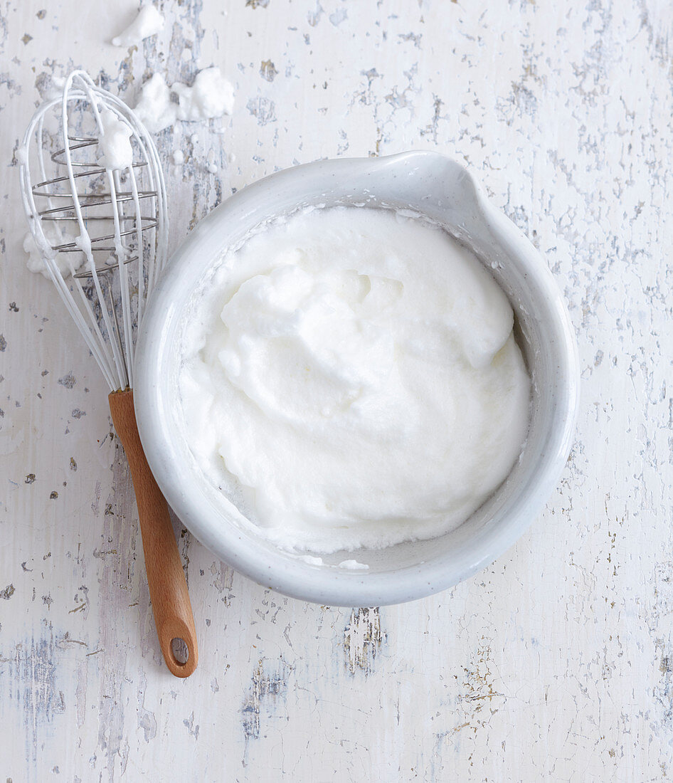 Beaten egg white in a mixing bowl