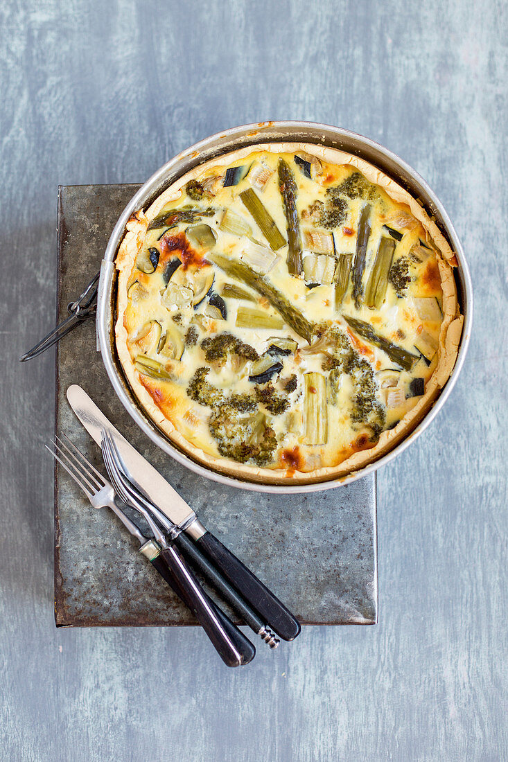 A green vegetable tart with asparagus, broccoli and zucchini