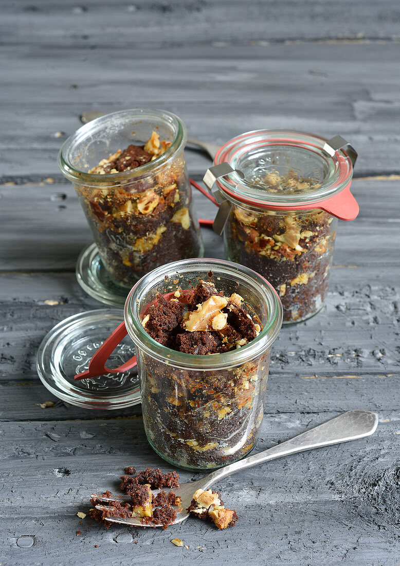 Brownie cake with nuts baked in glass jars