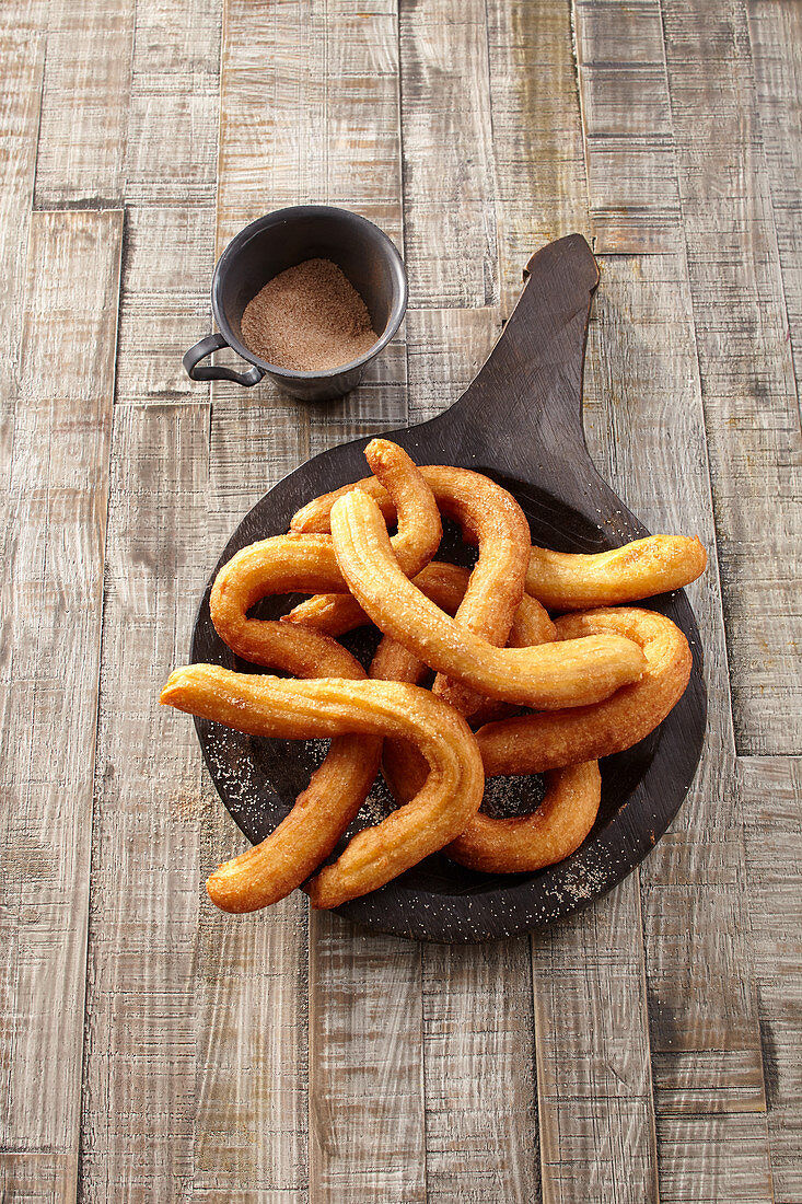 A churro, a fried dough sweet pastry based snack