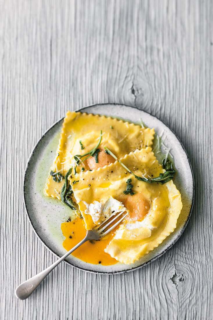 Ricotta ravioli with a liquid core and sage