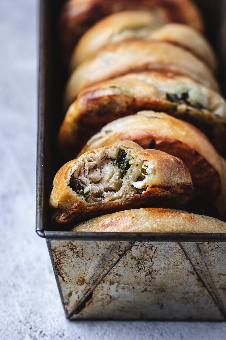 Greek handpies made of phyllo pastry, filled with feta and spinach