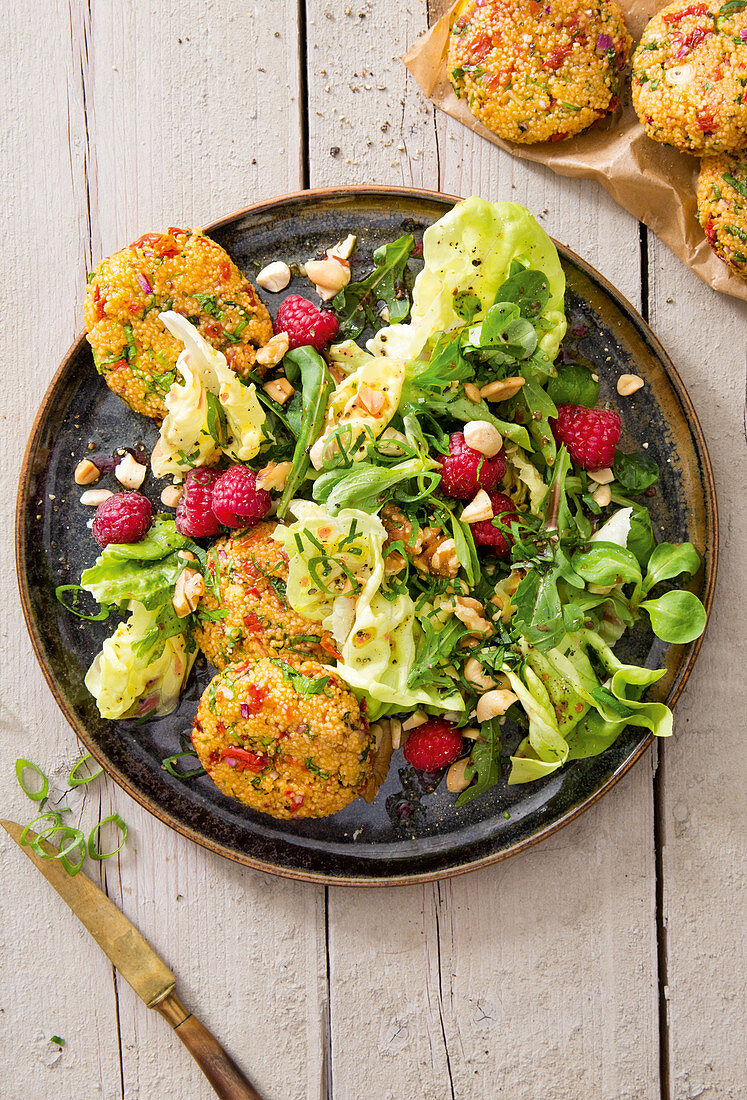 Tomato and couscous fritters with a summer salad and raspberries