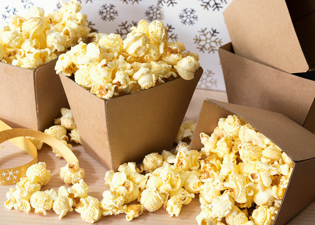 Maple butter popcorn in small cardboard boxes
