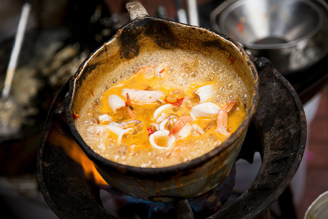 Sea Food cooked in a street food stand in China Town, Bangkok