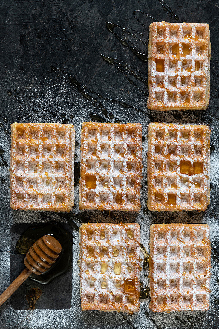 Waffles with icing sugard and honey