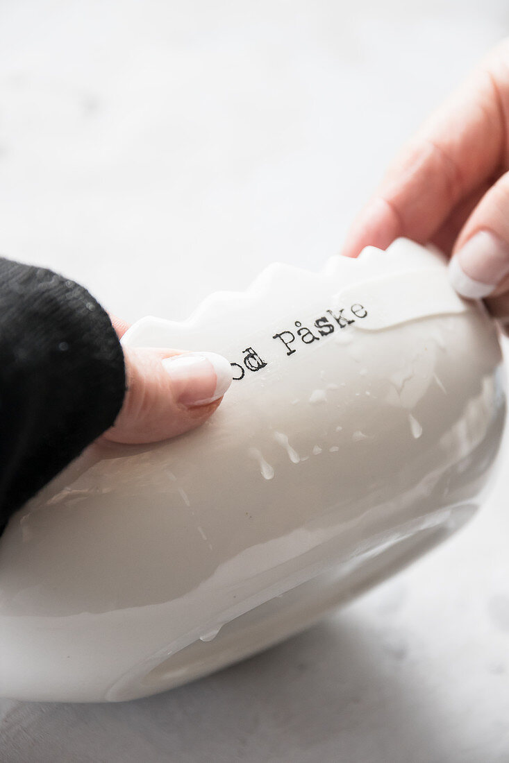 Decorating a white egg-shaped bowl